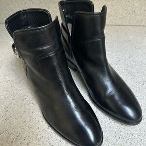 MK Black leather ankle boots with buckle detail 9